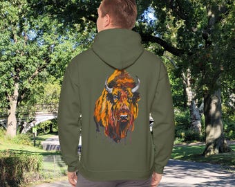 May include: A green hooded sweatshirt with a colorful illustration of a bison on the back. The bison is painted in shades of orange, yellow, and brown.