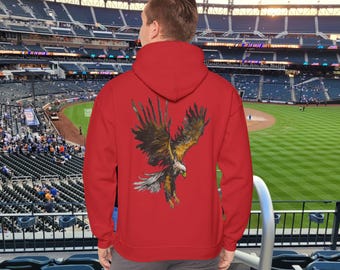 May include: Red hooded sweatshirt with a graphic print of a golden eagle in flight. The eagle is depicted in a watercolor style with brown, black, and yellow colors.