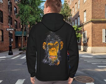 May include: Black hooded sweatshirt with a graphic print of a chimpanzee's face on the back. The chimpanzee has a serious expression and is looking directly at the viewer.