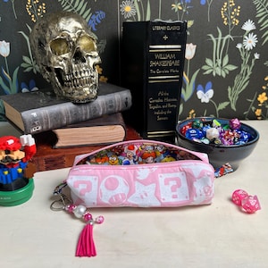 Bolsos pequeños con cremallera inspirados en la Princesa Peach y Yoshi