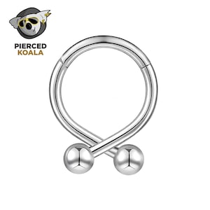 May include: A silver-coloured, hinged piercing ring with two small, round, silver-coloured balls at the bottom. The ring is in a circular shape with a twist design. The logo "Pierced Koala" is in the upper left corner.
