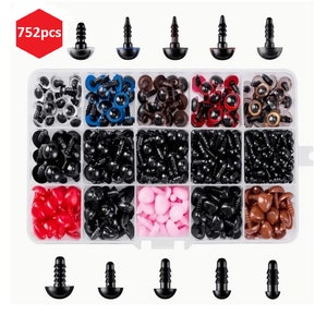 May include: A clear plastic storage box with 752 pieces of assorted plastic eyes and noses for stuffed animals. The eyes come in a variety of sizes and colors, including black, brown, blue, and red. The noses are brown and heart-shaped.