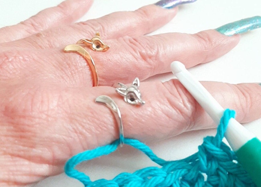Colored Peacock crochet or knitting ring, a yarn tension aid for crocheting  and knitting