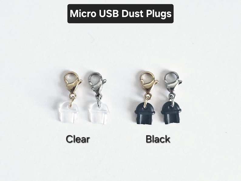 May include: Two sets of micro USB dust plugs, one set is clear and the other is black. Each set has two plugs with a gold, silver, or black metal hook.