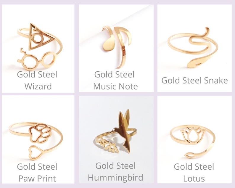 May include: Six gold-colored steel rings with various designs. The designs include a wizard symbol, musical note, snake, paw print, hummingbird, and lotus flower. Each ring has the words "Gold Steel" and a design name below it.