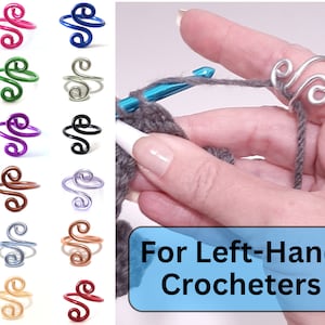 May include: A set of 10 colorful crocheting finger rings. The rings are made of wire and are designed to hold yarn while crocheting. The rings are shown in various colors, including pink, blue, green, purple, black, lavender, brown, gold, and red. The image also shows a hand holding a crochet hook and yarn, demonstrating how to use the rings. The text "For Left-Hand Crocheters" is displayed on a blue background.