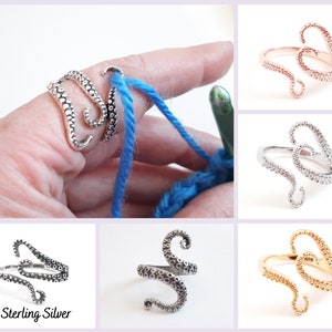 May include: A set of three octopus-shaped rings for holding yarn while crocheting. The rings are shown in silver, rose gold, and gold.