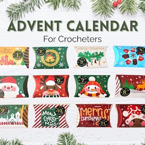 May include: An advent calendar for crocheters featuring twelve rectangular pillow boxes with festive holiday designs. Each box is numbered one through twelve and displays colorful illustrations of Santa, reindeer, snowmen, and Christmas motifs.