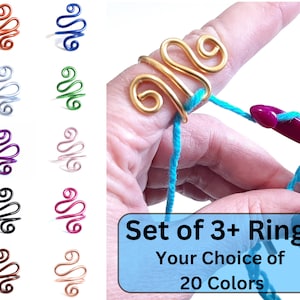 May include: Set of 3 or more colorful wire rings for crocheting. The rings are available in 20 colors. The image shows a gold ring on a finger holding turquoise yarn.
