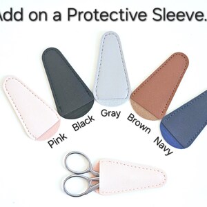May include: Six different coloured leather scissor sleeves in pink, black, grey, brown, navy, and white. The sleeves are designed to protect the blades of scissors.
