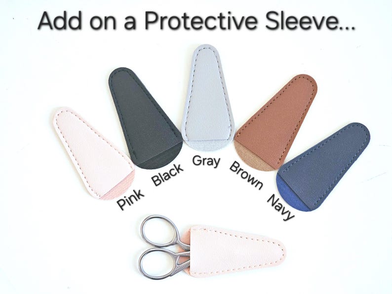 May include: Six different coloured leather scissor sleeves in pink, black, grey, brown, navy, and white. The sleeves are designed to protect the blades of scissors.