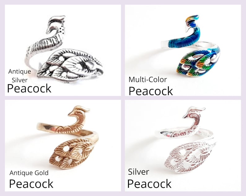 May include: Four peacock-themed rings in antique silver, multi-color, antique gold, and silver. Each ring features a peacock design with the text "Peacock" below each ring.