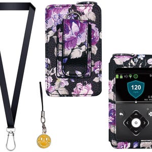 May include: A black lanyard with a silver clasp and a yellow smiley face charm. Also shown are two cases with a floral pattern of purple and white flowers on a black background. One case has a belt clip and the other holds a device with a screen displaying a blood glucose reading.