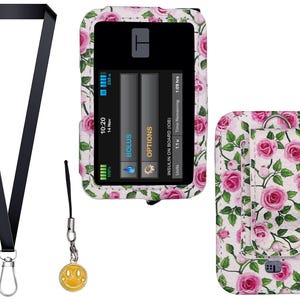 May include: A black lanyard with a silver clasp and a yellow smiley face charm. A medical device case with a floral rose pattern is also shown, along with a matching belt clip case. The device screen displays information.