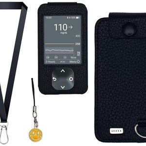 May include: A black blood glucose meter showing a reading of 110 mg/dL, in a textured black case. Accessories include a black lanyard and a yellow smiley face charm. The case has a snap closure.
