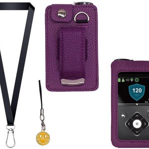 May include: A purple leather case and cover for a medical device, with a black lanyard and a yellow smiley face charm. The device screen displays a reading of 120 mg/dL. The case has a belt clip.