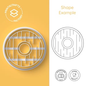 May include: A white outline of a round cookie cutter with a circle in the centre and lines radiating from the centre. The cookie cutter is on a yellow background. The text "Print & Crafts Factory" is in a circle above the cookie cutter. The text "Shape Example" is on the right side of the image. Below the cookie cutter are two round stamps, one that says "Dishwasher Safe" and the other that says "Food Safety".
