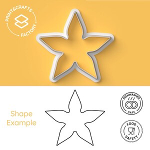 May include: A white five-pointed star-shaped cookie cutter. The image includes the text PRINT & CRAFTS FACTORY, the words Shape Example, and two circular icons indicating the item is dishwasher safe and food safe.