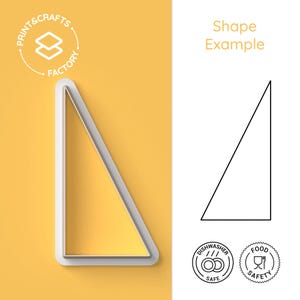 May include: A white plastic cookie cutter in the shape of a right triangle, with a yellow background. The text "Shape Example" is above a black outline of the triangle. The text "Print & Crafts Factory" is in a circle in the upper left corner. The cutter is dishwasher safe and food safe.