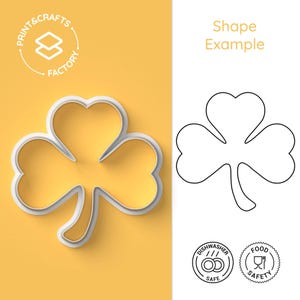 May include: A white plastic cookie cutter in the shape of a shamrock, with a 3D effect, on a yellow background. The cutter is dishwasher and food safe. The image also includes a line drawing of the shamrock.