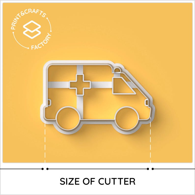 May include: White plastic cookie cutter shaped like an ambulance. The ambulance has a red cross on the side and a white background. The cookie cutter is on a yellow background.