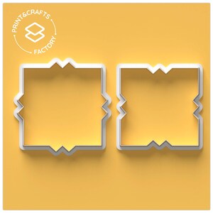 May include: Two white, square cookie cutters with a distinctive zig-zag design, set against a yellow backdrop. The cutters are positioned next to each other. The Print & Crafts Factory logo is in the top left corner.