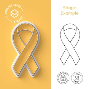 Puede incluir: Un cortador de galletas con forma de lazo amarillo con borde blanco, sobre un fondo amarillo. La imagen incluye un dibujo lineal de la forma del lazo e iconos que indican la seguridad del lavavajillas y de los alimentos.