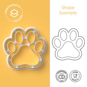 Può includere: Un tagliapasta in plastica bianca a forma di impronta di zampa con un effetto 3D. Il tagliapasta è su uno sfondo giallo. L'immagine include anche un disegno a linea dell'impronta di zampa, due icone che indicano la lavastoviglie e la sicurezza alimentare, e il testo "Shape Example" e "Print & Crafts Factory".