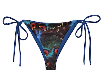 May include: Blue bikini bottom with a butterfly print. The bikini bottom has adjustable ties on the sides.