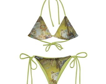 May include: A green bikini with a tie-side bottom and a triangle top. The fabric features a vintage painting of angels and a religious figure.