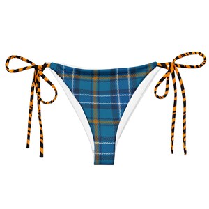 Puede incluir: Braga de bikini de cuadros azules y naranjas con lazos a rayas negras y naranjas.