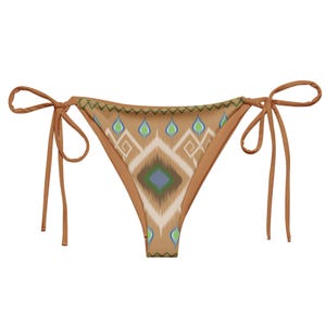 May include: A brown bikini bottom with a geometric pattern in shades of blue, green, and white. The bikini bottom has adjustable ties on each side.