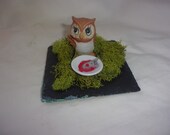 Owl having lunch diorama