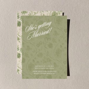 May include: A wedding invitation with a green floral pattern and the text "She's getting Married!" in elegant script. The invitation includes details about the couple's registry.