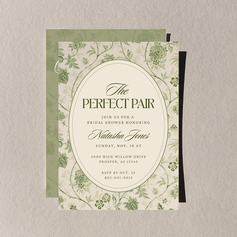 May include: A bridal shower invitation with a floral design in shades of green and cream. The text reads "The Perfect Pair" and includes details for the event, such as the date, time, and location. The invitation is layered with a matching patterned envelope.