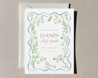 Puede incluir: Una invitación de baby shower blanca con un borde azul e ilustraciones florales verdes. El texto dice "Please join us for Dani's Baby Sprinkle 2PM | Sadelles's 11.10.24"