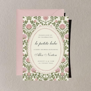 May include: Baby shower invitation with a floral pattern in pink and green. The invitation includes the text "le petite bebe" and details for Alex Norton's baby shower, including the date, time, and location. A pink envelope is behind the invitation.
