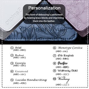 May include: A close-up of a blue leather journal with the text "Chandler Vivian" embossed on the cover. The image shows 10 different font options for personalization, including Arial, Bodoni, Georgia, Garamond, Lucida Handwriting, Monotype Corsiva, Old English, Pacifico, Walkway Bold, and Windsong.