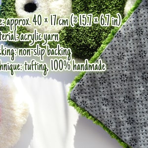 Back side of handmade tufted keyboard rug with non slip backing and size details