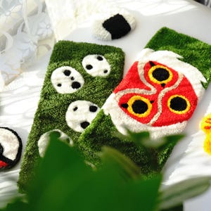 Angled side view of handmade anime keyboard rugs, tufted acrylic desk mats