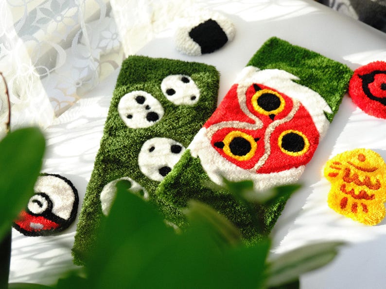 Angled side view of handmade anime keyboard rugs, tufted acrylic desk mats