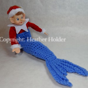 Peut inclure: Une queue de sirène en crochet bleu pour une poupée elfe. La queue a une nageoire à l'extrémité et est faite avec un fil bleu.
