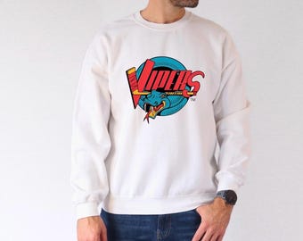 May include: White sweatshirt with a blue and red logo of a snake with the word "VIPERS" in red letters. The logo is surrounded by a blue circle with a red and white hockey stick.