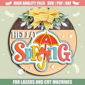 May include: A circular wooden sign with the words "HELLO Spring" in bright colours, featuring an umbrella design. The sign is decorated with a yellow bow and greenery. The text "HIGH QUALITY FILES SVG | PDF | DXF" is at the top, and "FOR LASERS AND CUT MACHINES" is at the bottom.