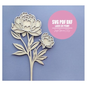 May include: A laser-cut peony design in light wood, featuring a large open bloom and a smaller bud, with leaves and stem. The image includes text in a pink circle that reads "SVG PDF DXF LASER CUT PEONY Joyful Unicorn SVGs".
