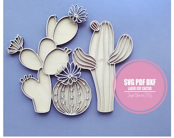 Puede incluir: Formas de cactus cortadas con láser de madera en varios estilos, incluyendo un cactus redondo, un cactus alto y un cactus de pala. Las formas son de color claro con diseños detallados recortados. La imagen incluye el texto "SVG PDF DXF Laser Cut Cactus".