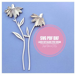 May include: Two-dimensional, layered white daisy flowers with stems and leaves against a light blue background. The image includes the text "SVG PDF DXF LASER CUT BLACK EYED SUSAN Joyful Unicorn SVGs" in a pink circle.
