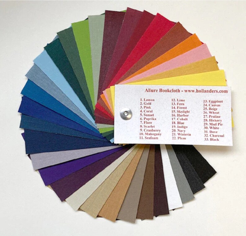 May include: A color chart of 33 different fabric swatches, arranged in a fan shape. The swatches are labeled with numbers and names, such as "Lemon", "Gold", "Pink", "Coral", "Sunset", "Paprika", "Flare", "Scarlet", "Cranberry", "Mahogany", "Seafoam", "Lime", "Fern", "Forest", "Skylight", "Harbor", "Cobalt", "Blue", "Indigo", "Navy", "Wisteria", "Plum", "Eggplant", "Canvas", "Beige", "Wheat", "Praline", "Hickory", "Mud Pie", "White", "Dove", "Charcoal", "Black". The chart is labeled "Allure Bookcloth - www.hollanders.com".
