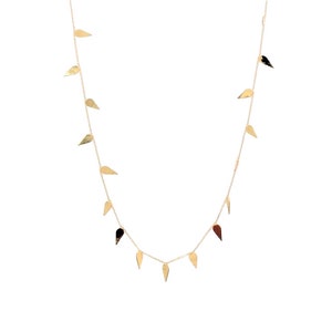 May include: A gold necklace with a delicate chain and multiple small, teardrop-shaped pendants.