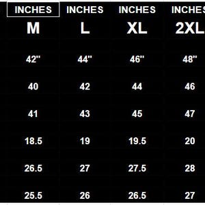 May include: A black chart displays garment sizes, including chest, waist, hip, shoulder, length, and arm measurements in inches. Sizes range from XS to 5XL, with corresponding measurements provided for each size.